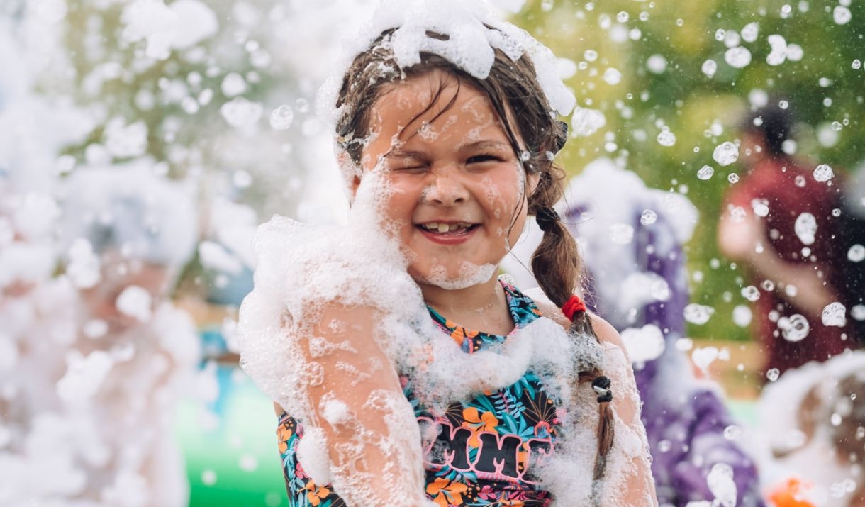 A girl in a foam party