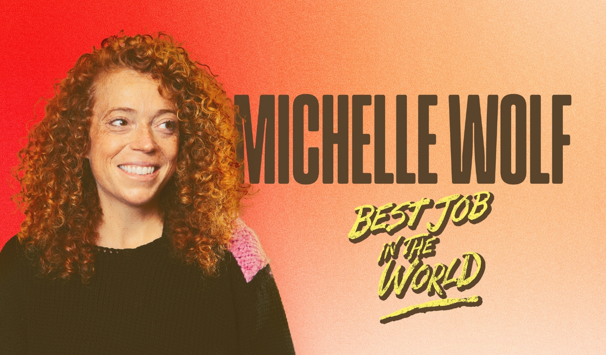 Smiling curly-haired person on an orange background with text "Michelle Wolf - Best Job in the World."