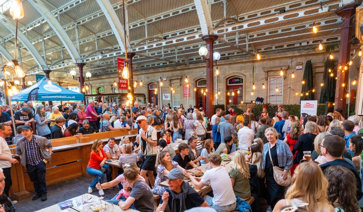 People sitting on one of the terraces at Green Park Brasserie and Bath Pizza Co.