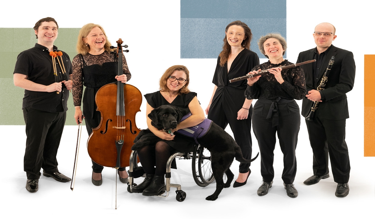 A group of orchestra members holding instruments