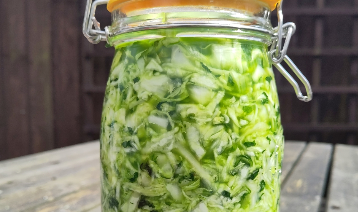 A mason jar of pickled cabbage