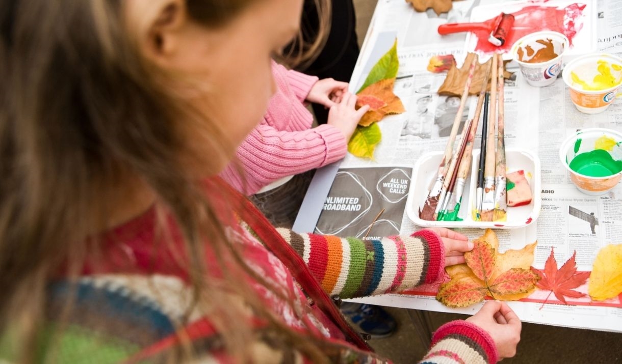 young child paints a picture