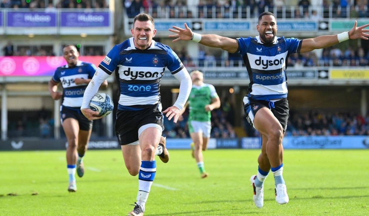 Men playing rugby