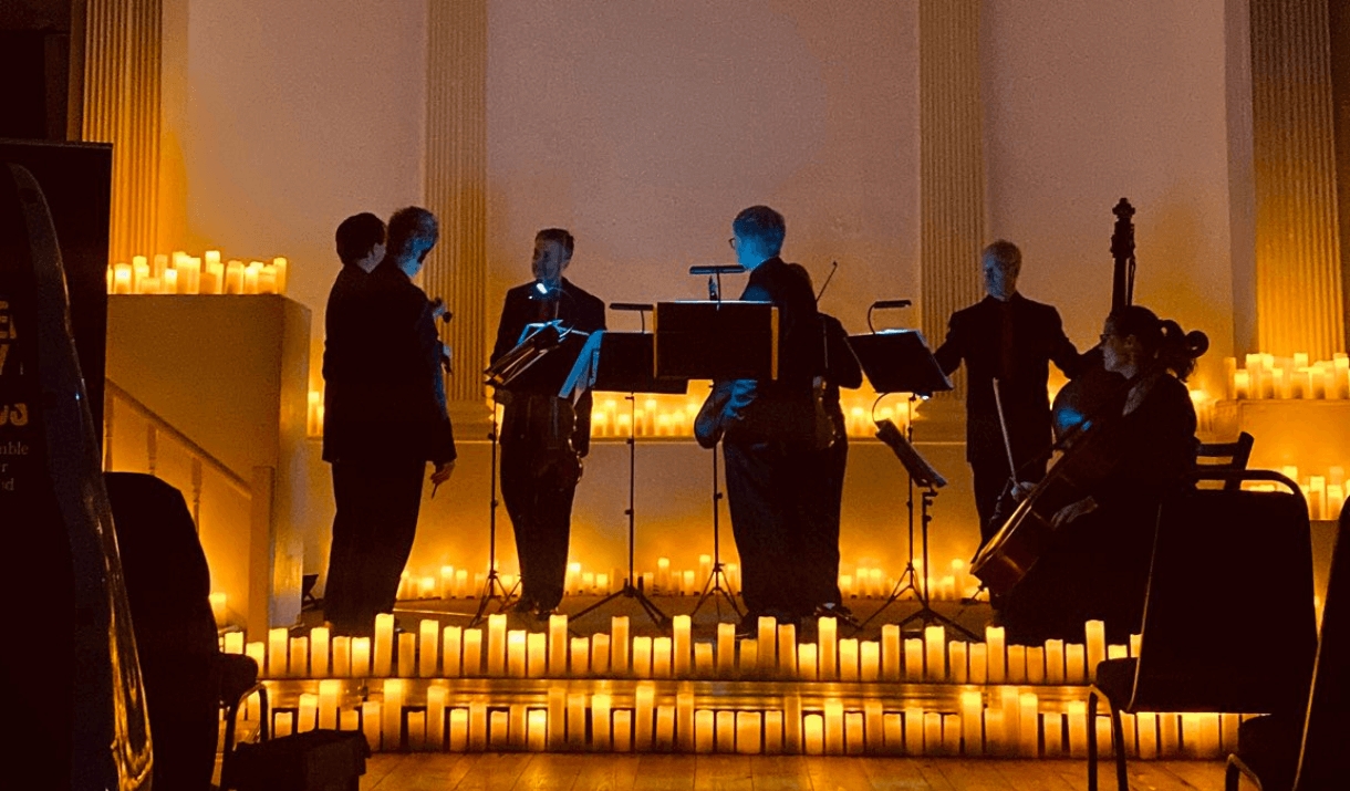 The Bristol Ensemble performing at The Mission Theatre in candlelight.