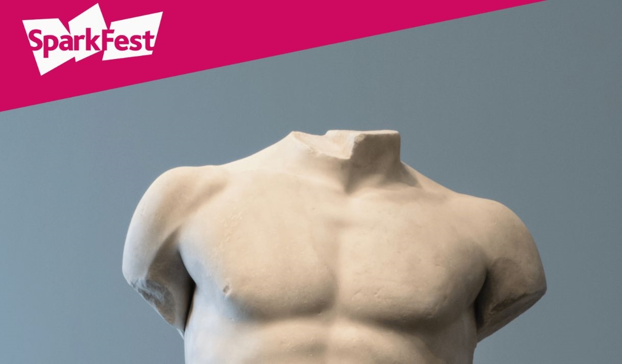 A marble headless and limbless roman statue. The Sparkfest corner is in the top corner