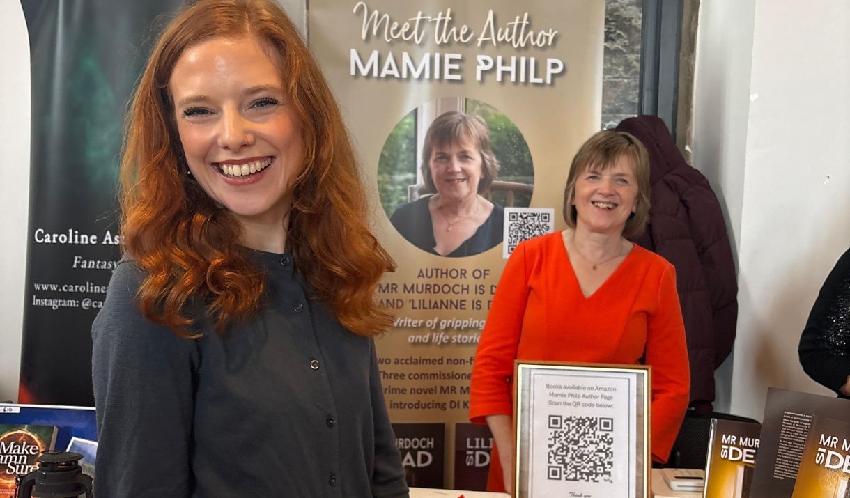 Author Mamie Philp and a fellow vendor at a stall during the Literary Escape Festival