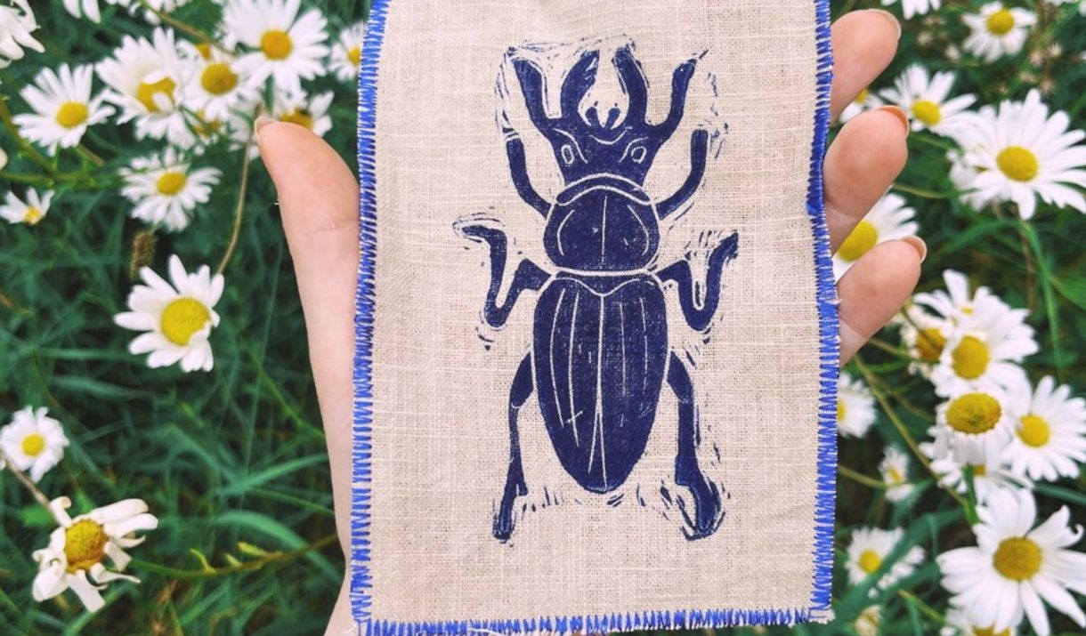 lino print beetle printed on a canvas patch