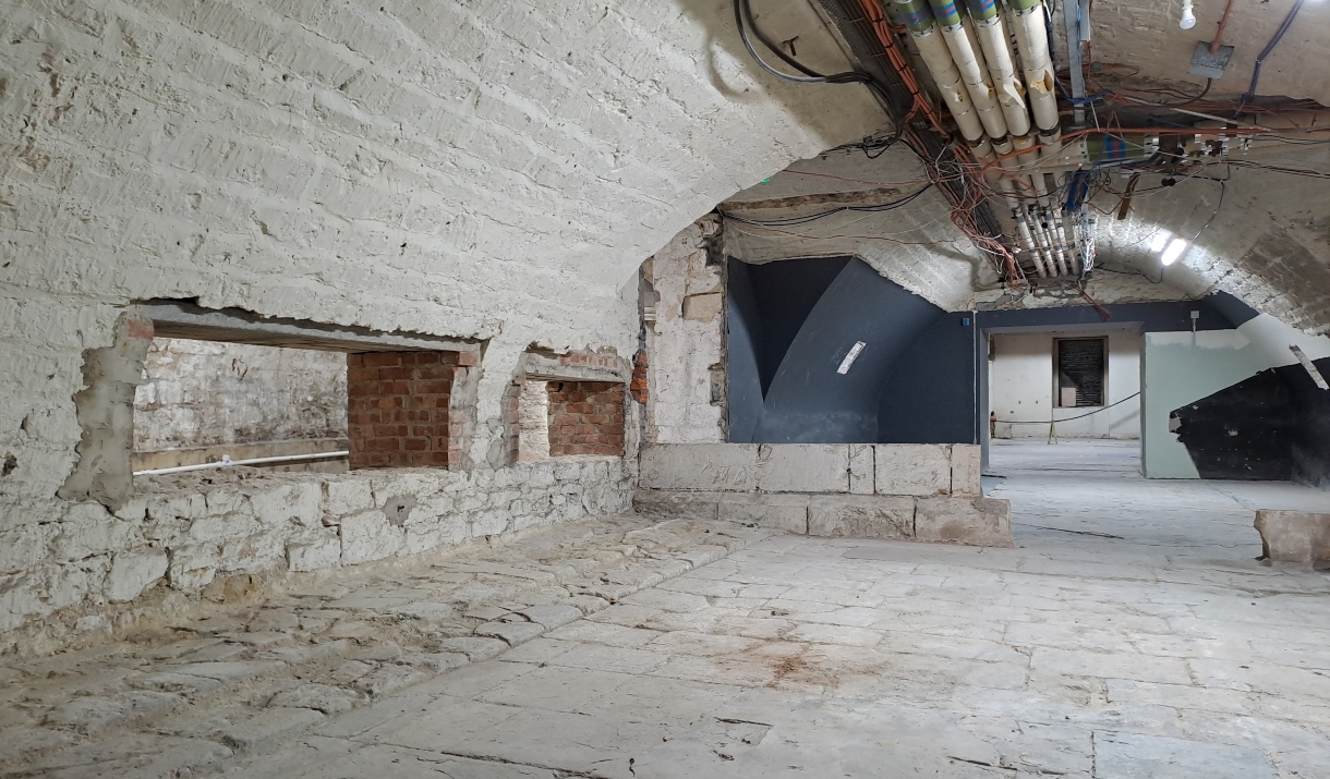 Original stone floors and vaulted ceilings in the basement at Bath Assembly Rooms