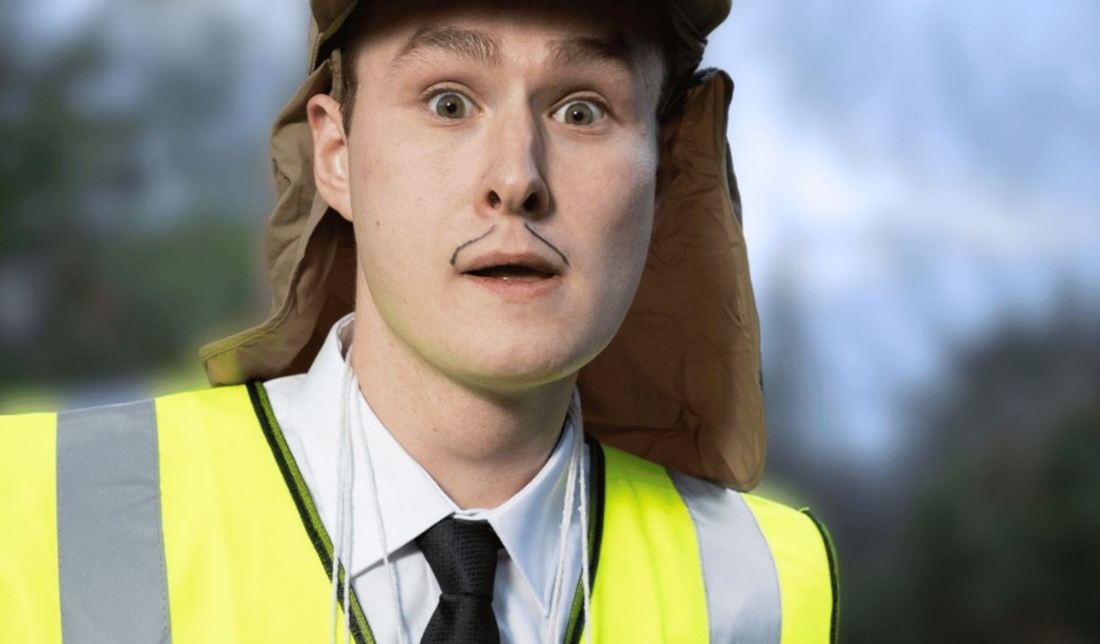 A young man staring wearing a hi-vis vest. Sparkfest logo in top corner