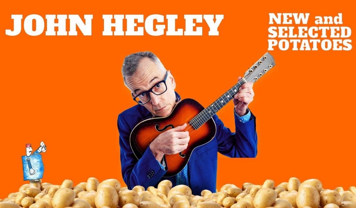 John Hegley on a pile of potatoes