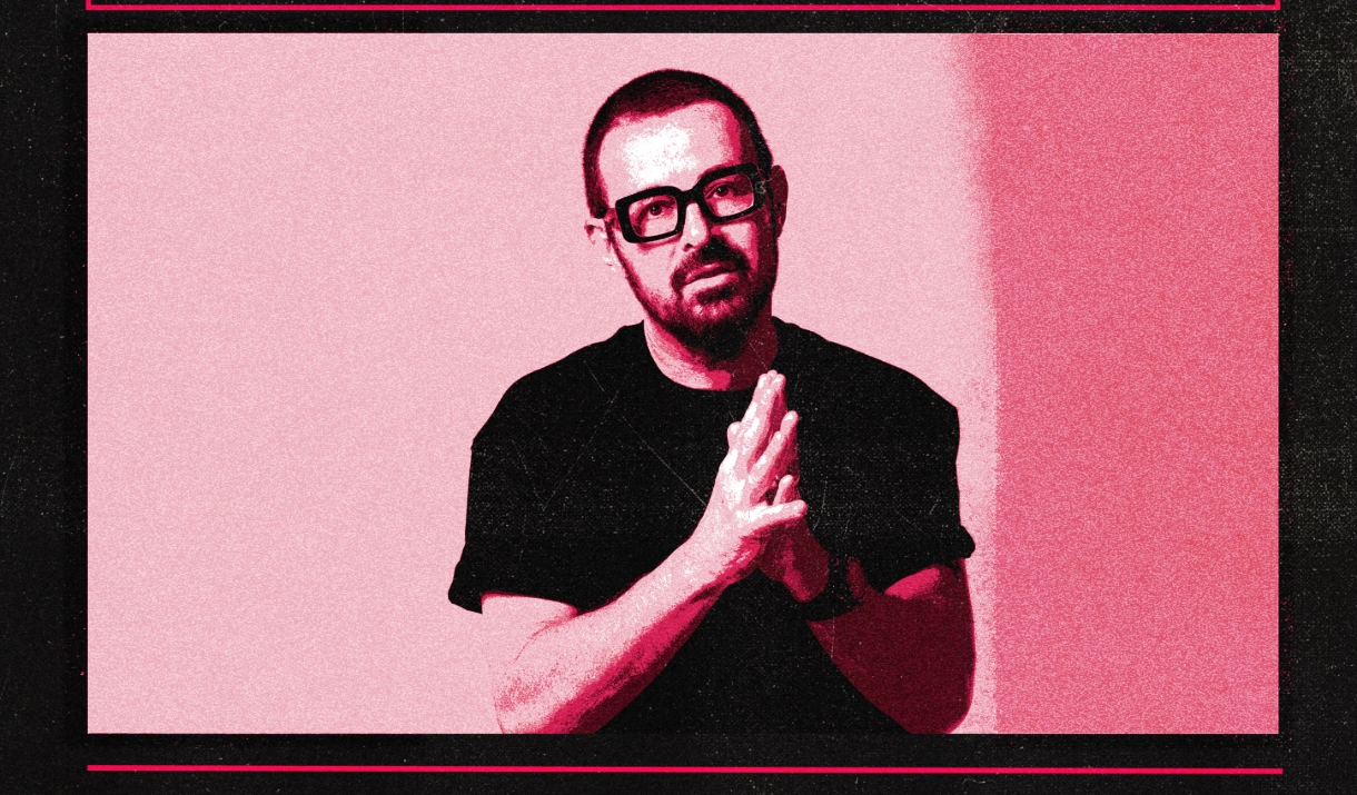 A photo in red tones of DJ Judge Jules