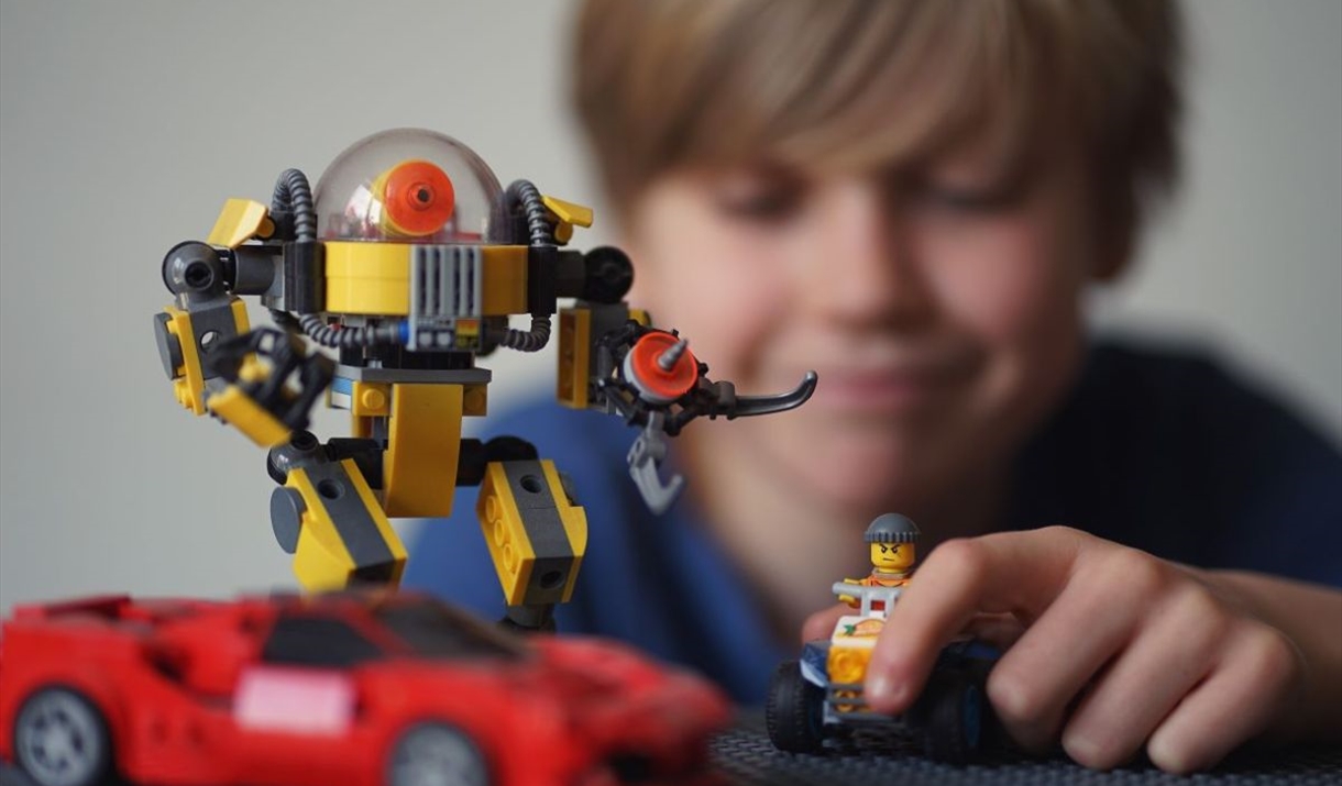 boy playing with lego
