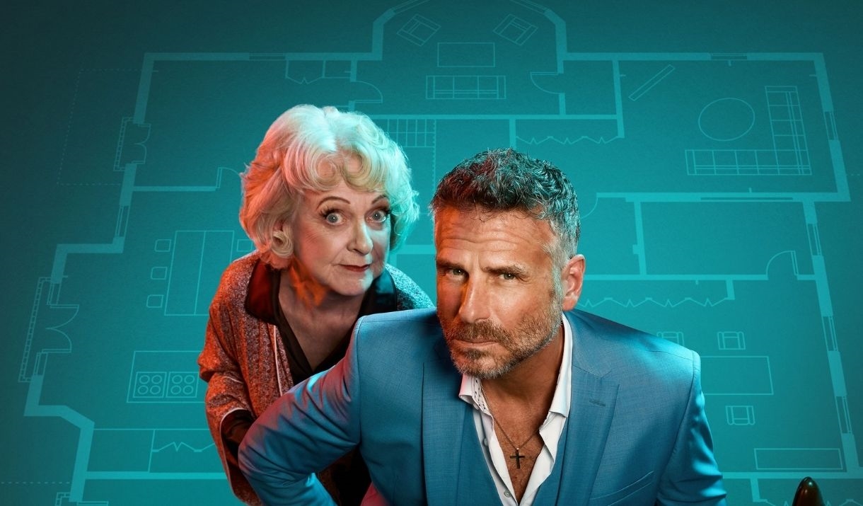 The cast of Murder at Midnight (Jason Durr, Susie Blake),  in front of a blue blueprint of a large house.