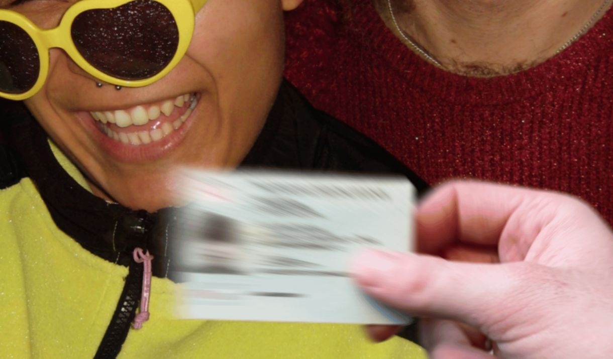 Two people in the middle of a chaotic uni club night, colourful plastic sunglasses included. Sparkfest logo in top corner