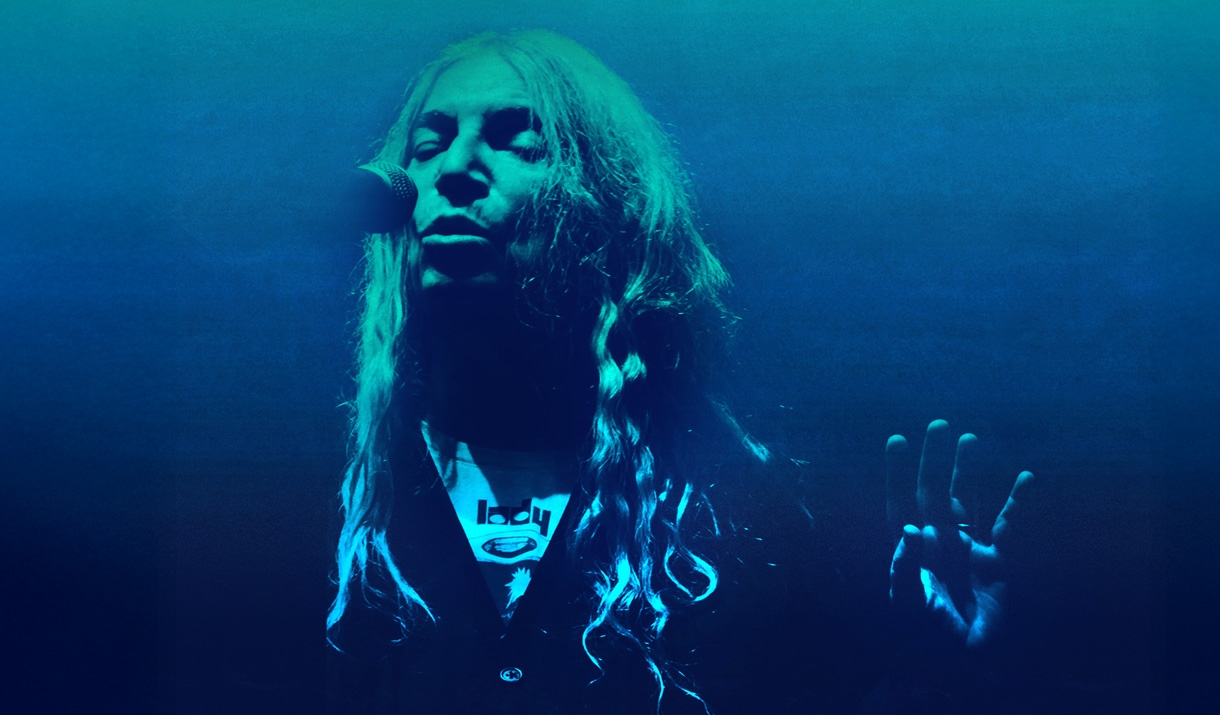 Woman singing on a microphone