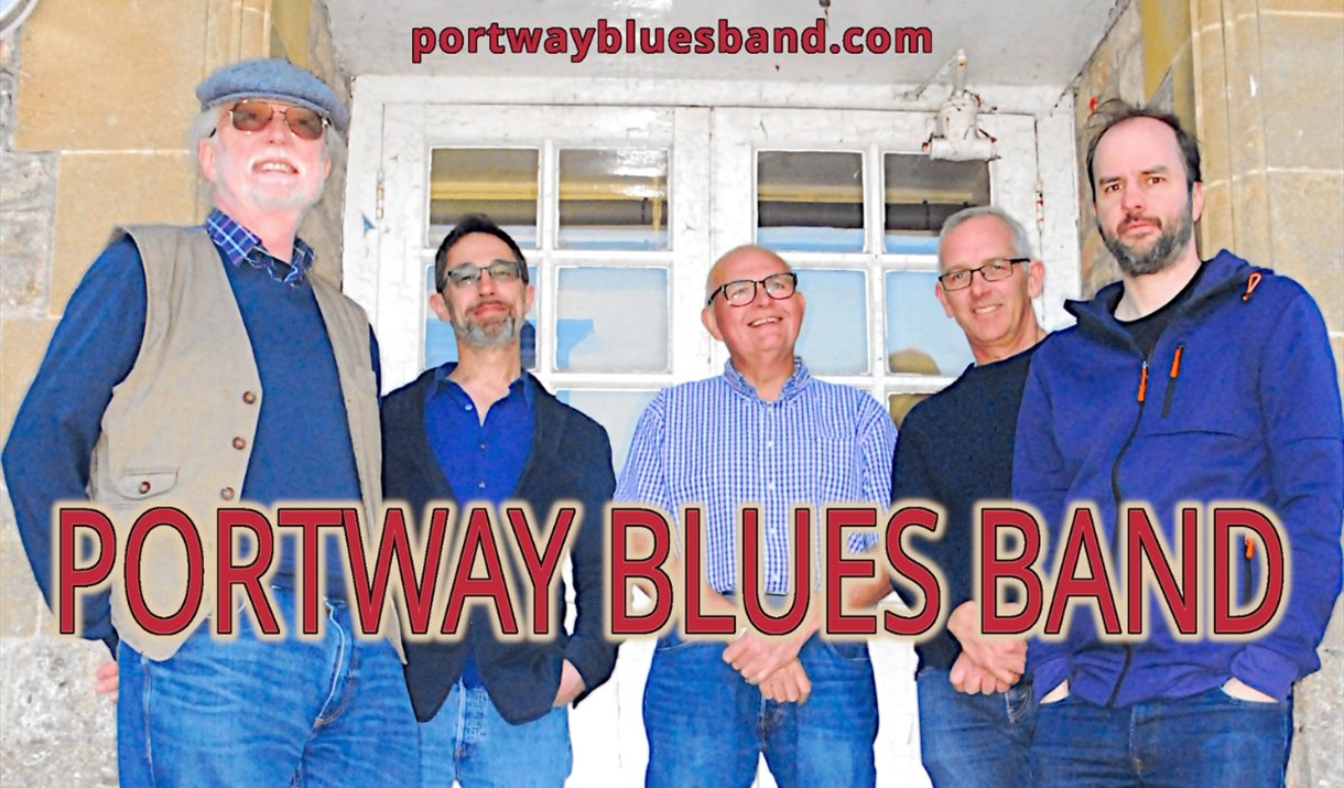 Four men standing in front of a door smiling, big red font in front reading 'Portway Blues Band'