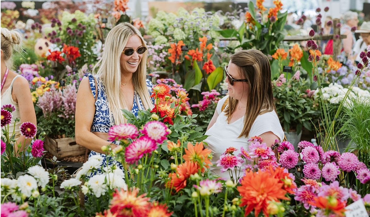 two women surronded by flowers