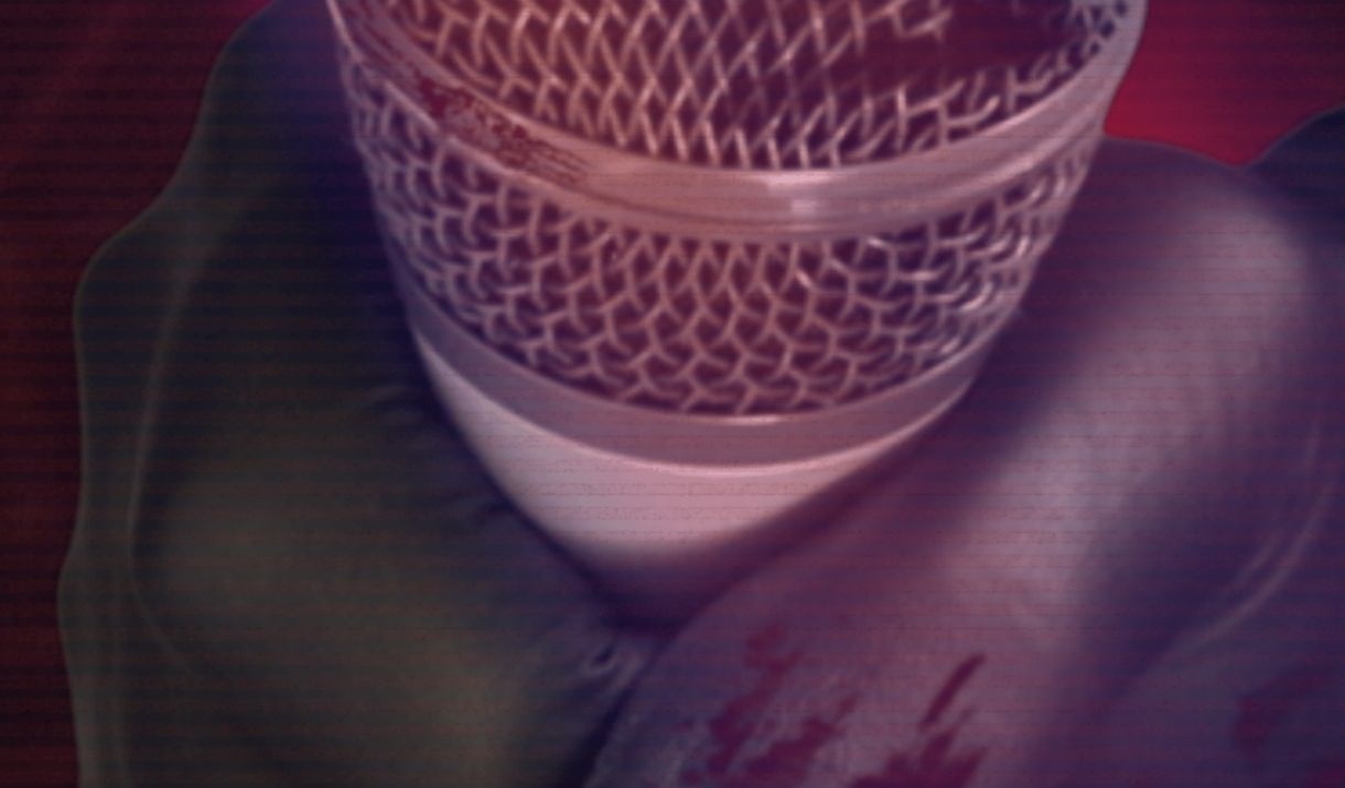 A bloodied black gloved hand holds out a microphone with a murderous red lighting. Sparkfest logo in top corner