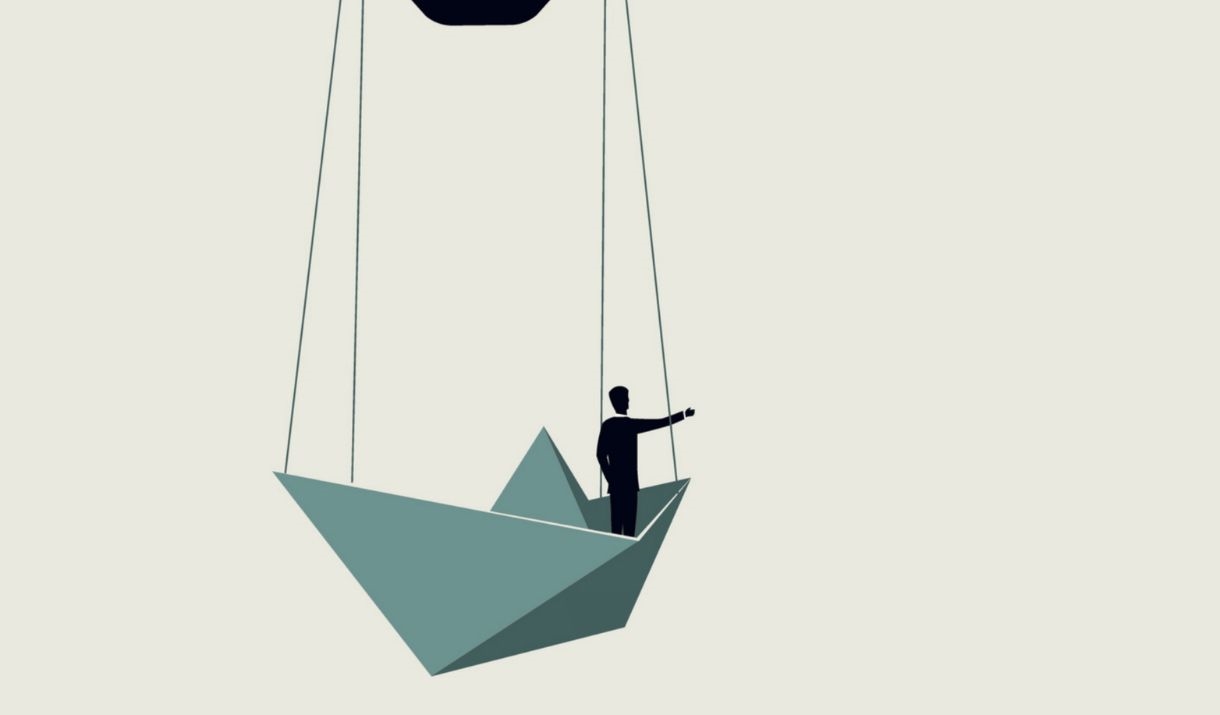 An illustrated red hot air balloon made from a light bulb carrying a paper boat with a silhouette of a person leaning out. Sparkfest logo in top corne