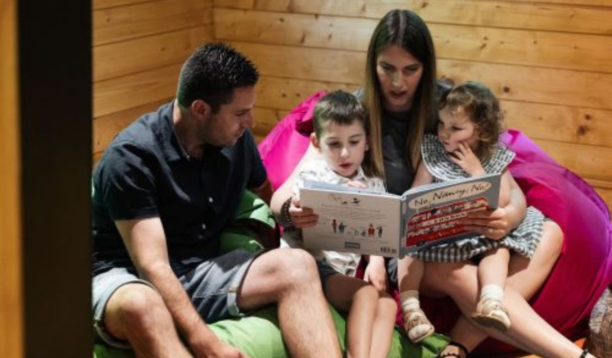 parents reading to their children