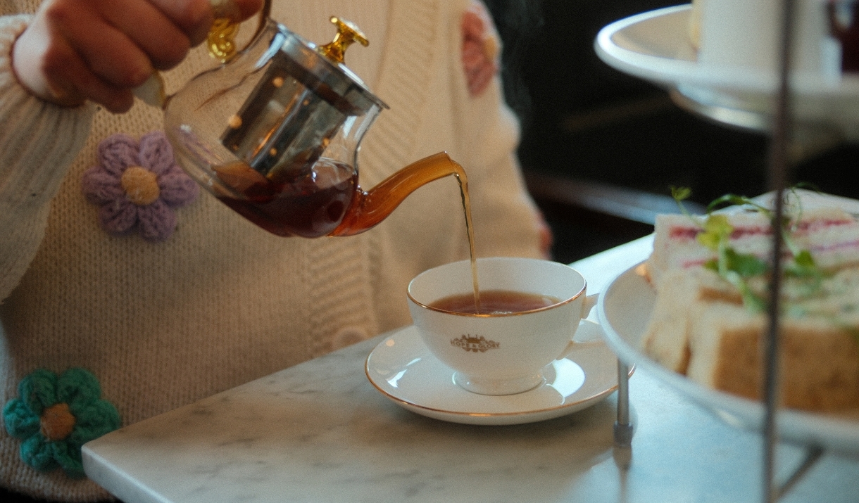 Person pouring tea