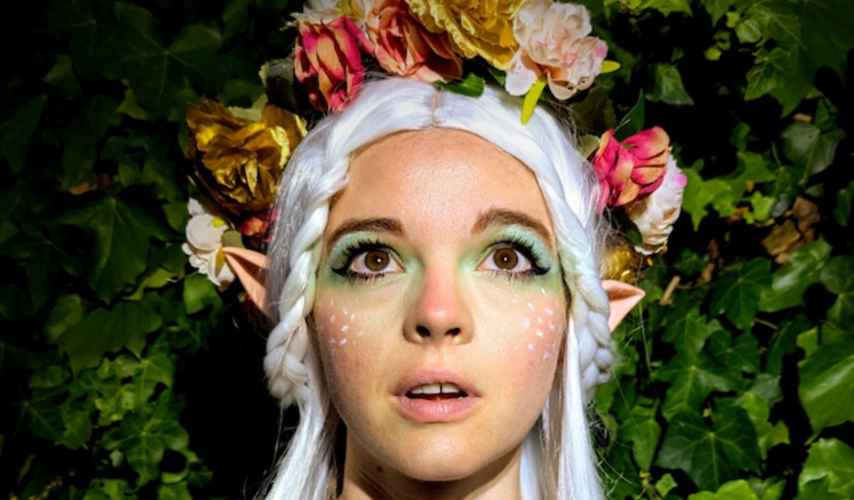 A beautiful elf among leaves