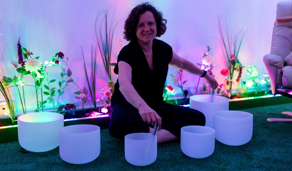 A woman leading a sound bath session at The Soul Spa in Bath.