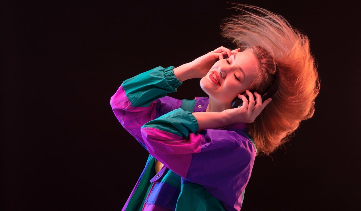 A women dancing with headphones