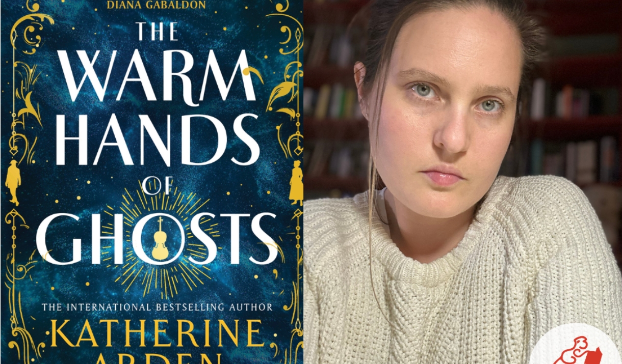 Author Katherine Arden with her book The Warm Hands of Ghosts