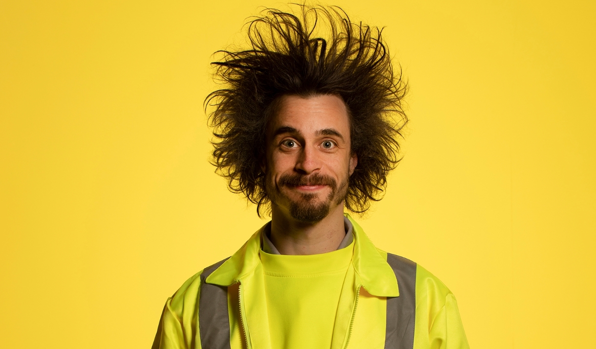 Viggo Venn in a high vis vest on a yellow background