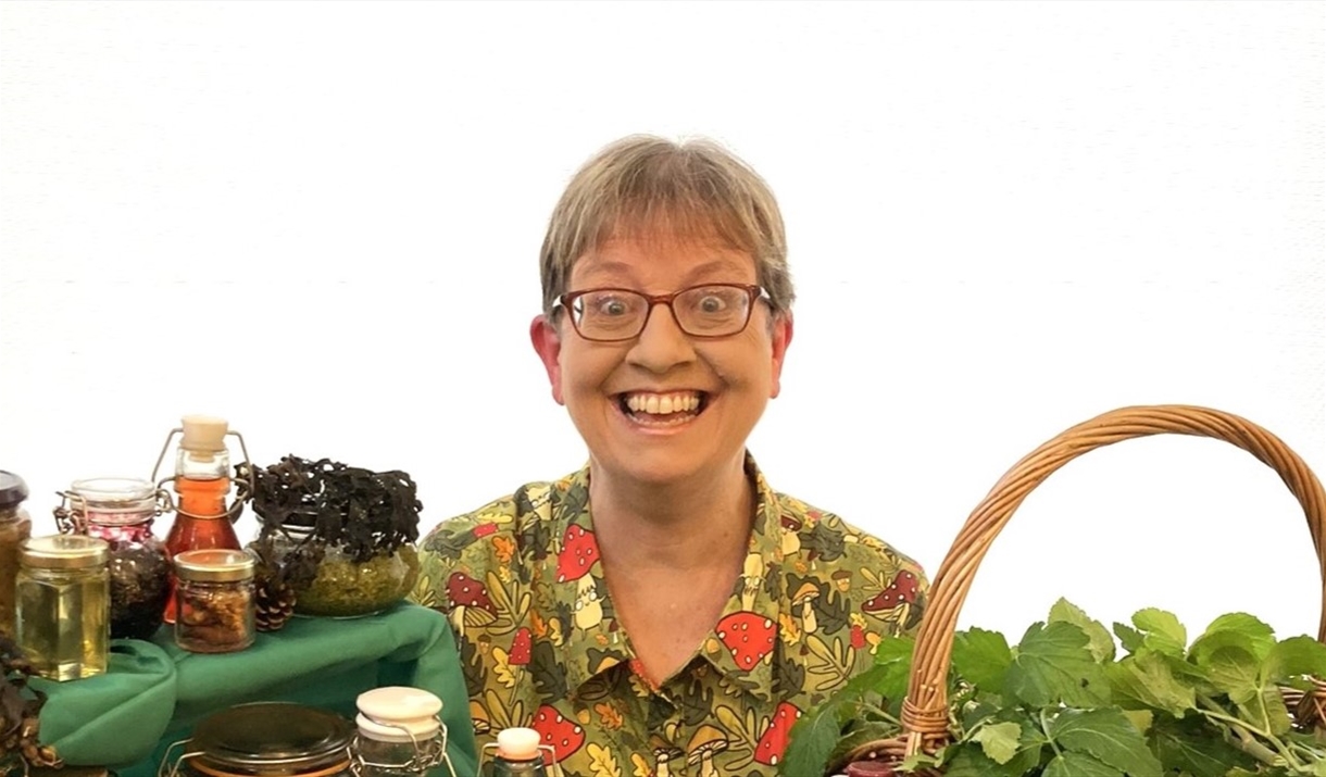 Helen Wood sits behind various foraged items