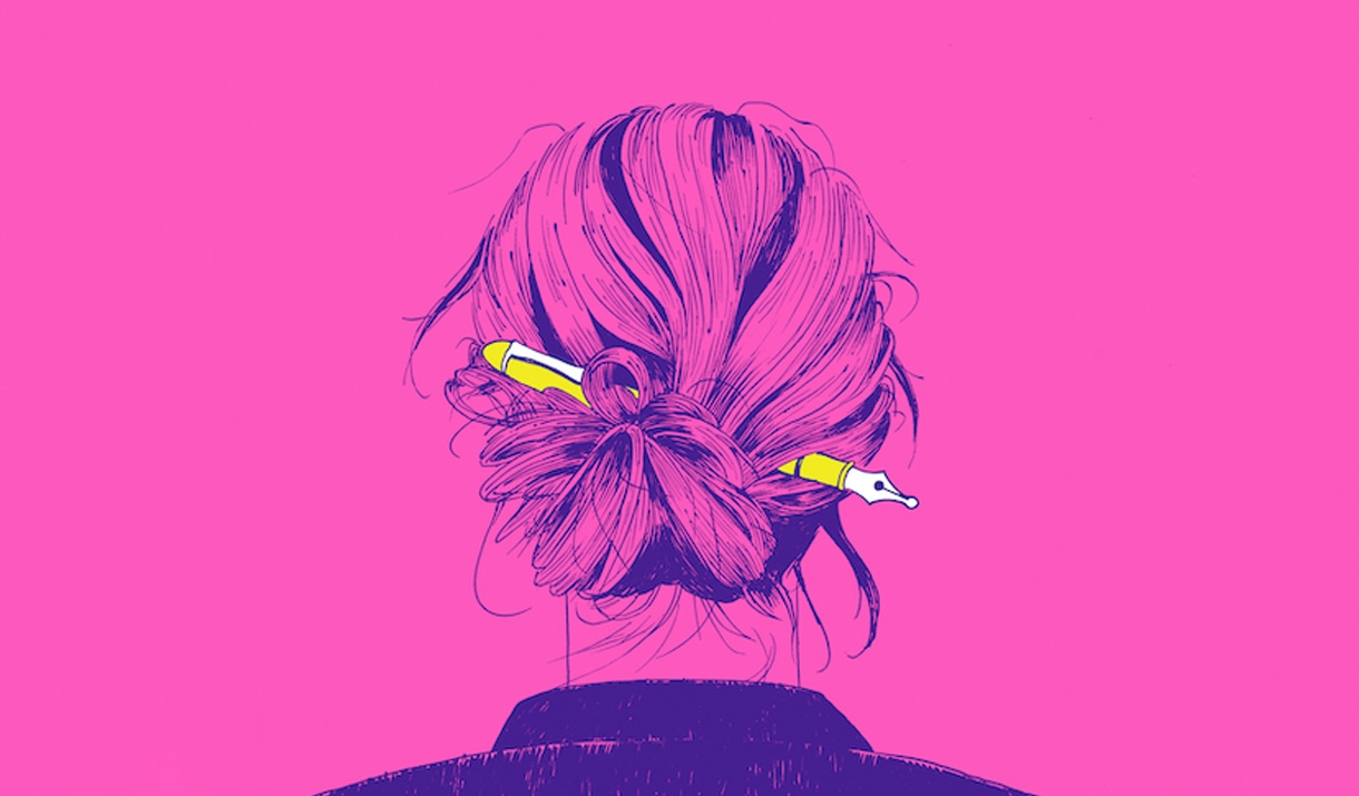 Looking at the back of a woman's hair pinned up with a fountain pen