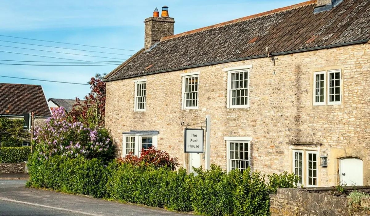 Cottage with bush outside