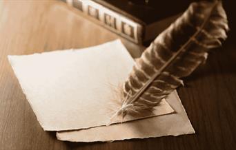 Writing quill and paper