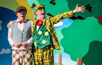 Two actors perform on stage