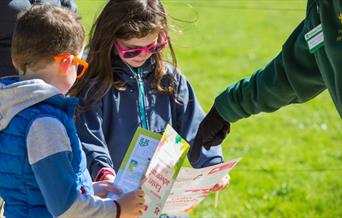 Children looking at Easter trail sheets