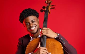Man holding the neck of a cello