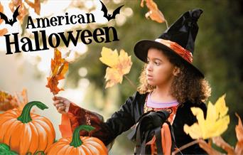 Girl in a witches costume having Halloween fun