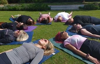 Women doing yoga stretches