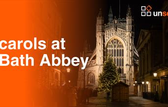 Bath Abbey at night with the caption 'carols at Bath Abbey' and Unseen's logo