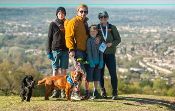 family standing on a cliff