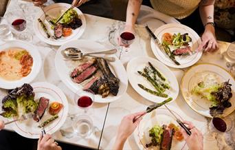 A table laden with food at the Emberwood brasserie in central Bath