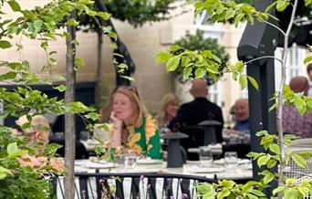 People sat in garden at hotel