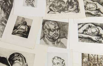 a selection of prints scattered on a table