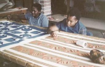 Women making quilts