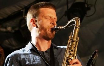 man playing saxophone