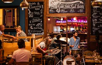 A band performing in a restaurant