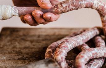 a sausage being made