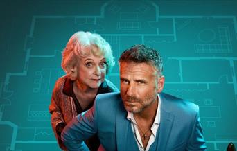 The cast of Murder at Midnight (Jason Durr, Susie Blake),  in front of a blue blueprint of a large house.