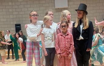 children performing a show